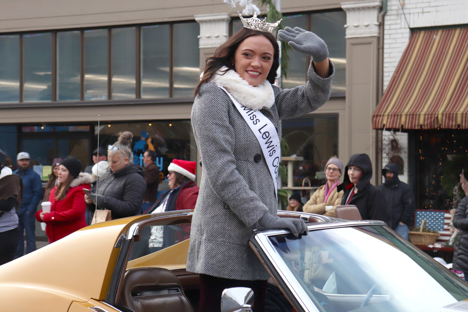 Miss Lewis County 2022 Briana Rasku waves from a car during the Santa Parade in downtown Chehalis on Saturday.