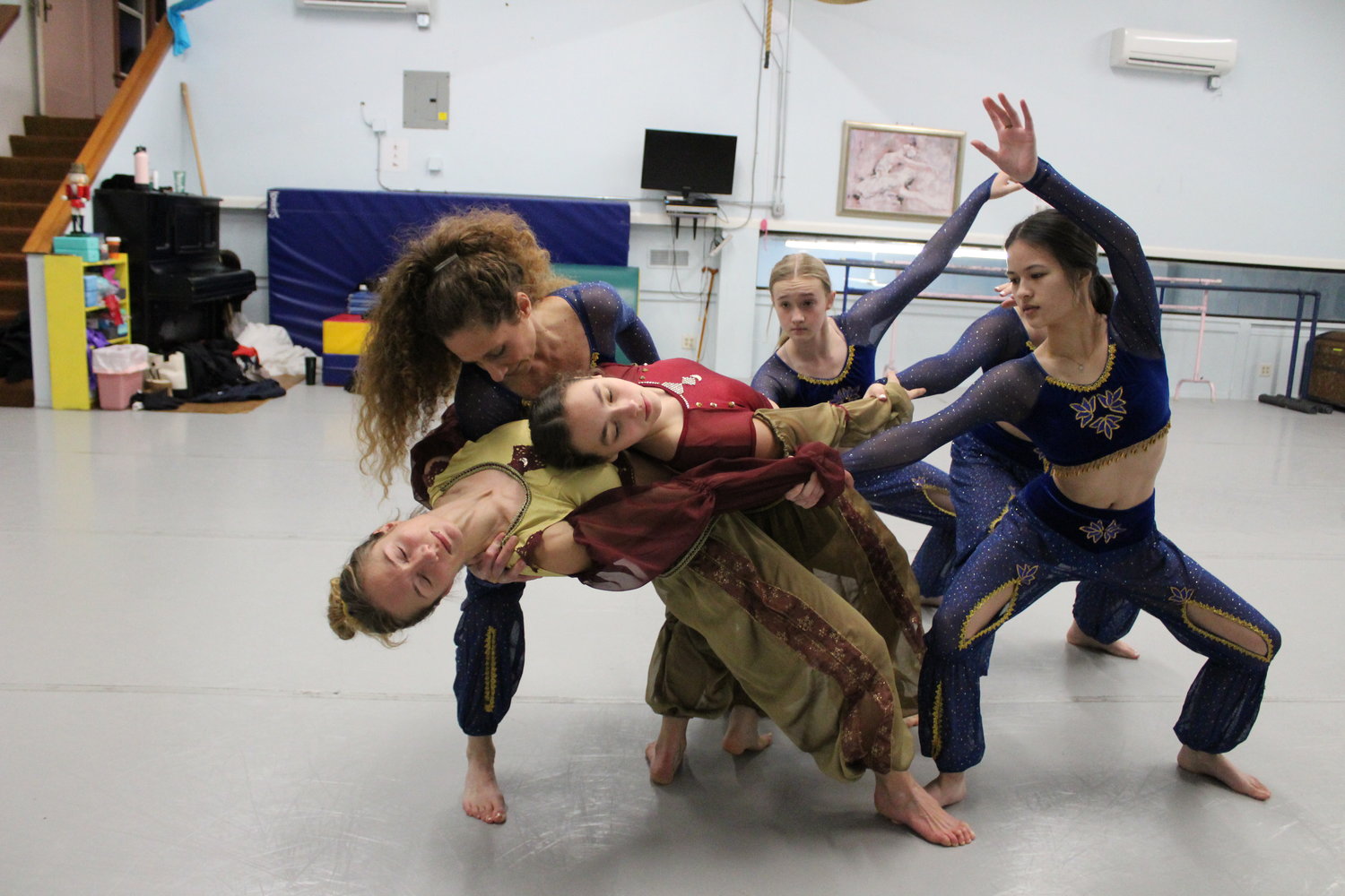 Brianna Jones, Capri O'Neill, Stacy Jones, Eva Reynolds, Erin Jennings and Hannah Feaster rehearse a complicated group dance move for the Arabian Corps portion of "The Nutcracker” ballet.