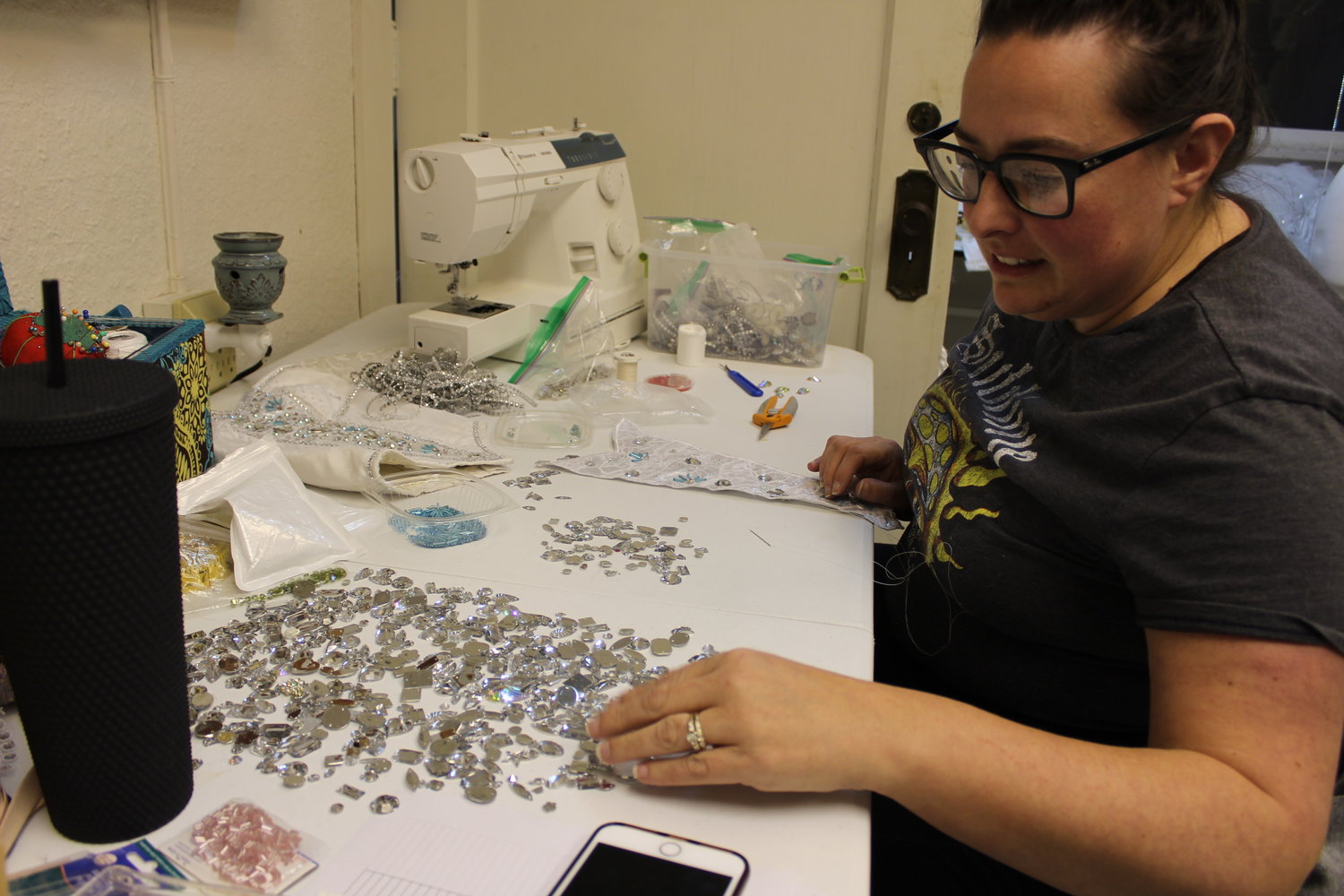 Sunny Evans sifts through gemstones to add to a costume piece for the upcoming performance of "The Nutcracker Ballet" by dancers from Southwest Washington Dance Center in Chehalis, taking place Dec. 16-18 at Corbet Theatre in Centralia.