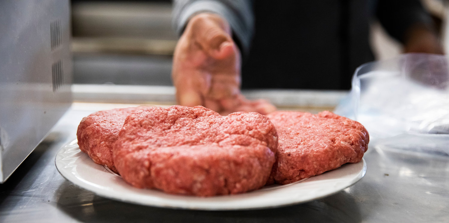 Half-pound burgers are prepared for the grill at Ocean Prime Family Restaurant in Chehalis Monday morning.