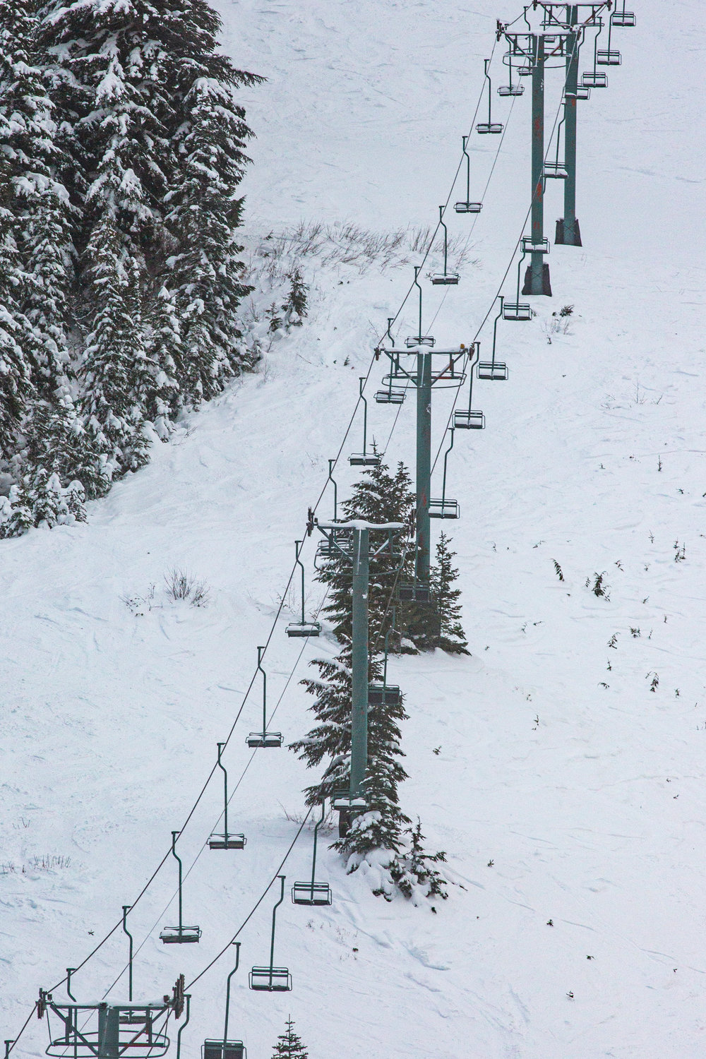 A chair lift at White Pass Ski Area stands still as very few visitors cover the mountain during the area’s first week of the seaon on Tuesday.