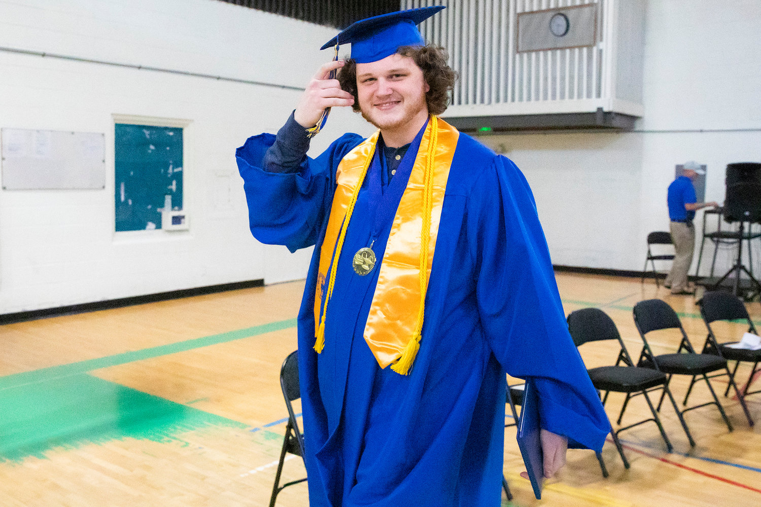 Zachary Carver smiles after getting his diploma on stage during a graduation ceremony for Centralia College graduates held at the Green Hill School on Wednesday in Chehalis.