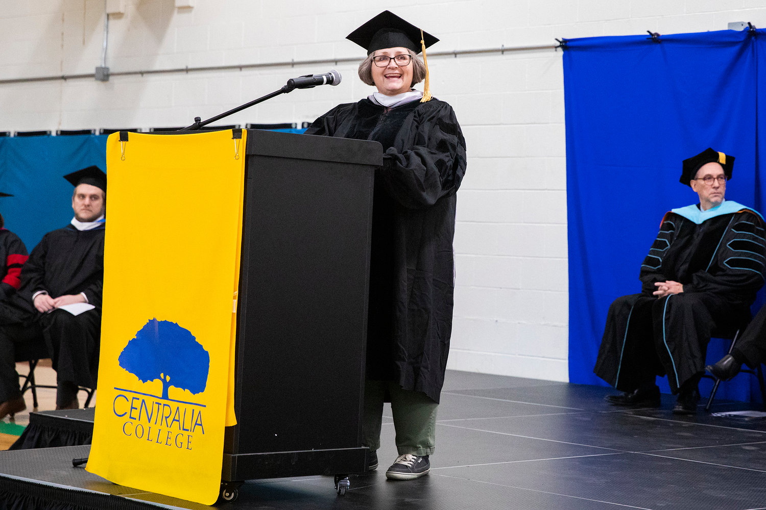 Dr. Jody Peterson smiles and describes working with all nine Centralia College graduates over the last two quarters during a graduation ceremony held at the Green Hill School on Wednesday in Chehalis.