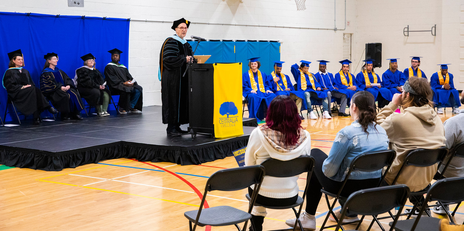 Centralia College President Dr. Bob Morhbacher talks about nine graduates during a graduation ceremony held at the Green Hill School on Wednesday in Chehalis.