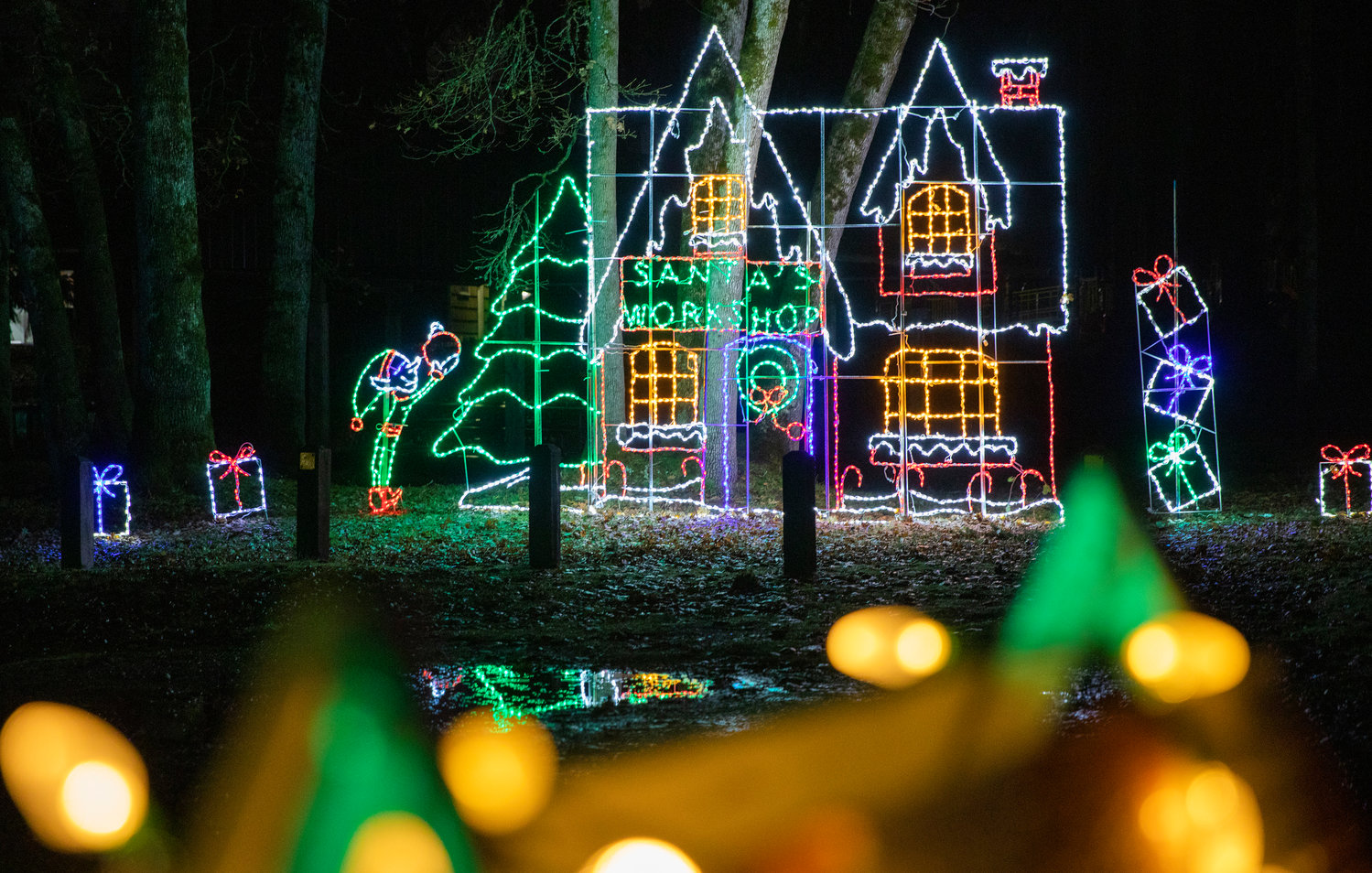 Santa’s Workshop is illuminated with Christmas Lights in Borst Park Thursday night.