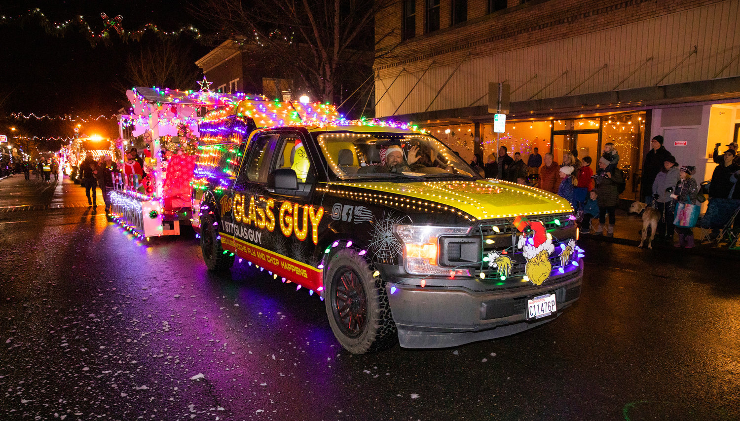 The Glass Guy truck is illuminated Saturday night in downtown Centralia for the Lighted Tractor Parade.