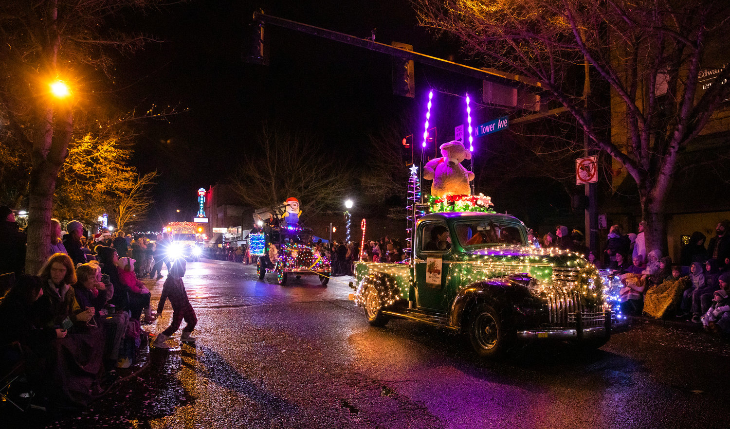 Crowds gather as floats roll on through downtown Centralia during the Lighted Tractor Parade Saturday night.
