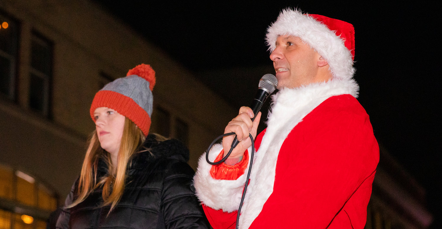 State Rep. Peter Abbarno announces floats during the Lighted Tractor Parade Saturday night in downtown Centralia.