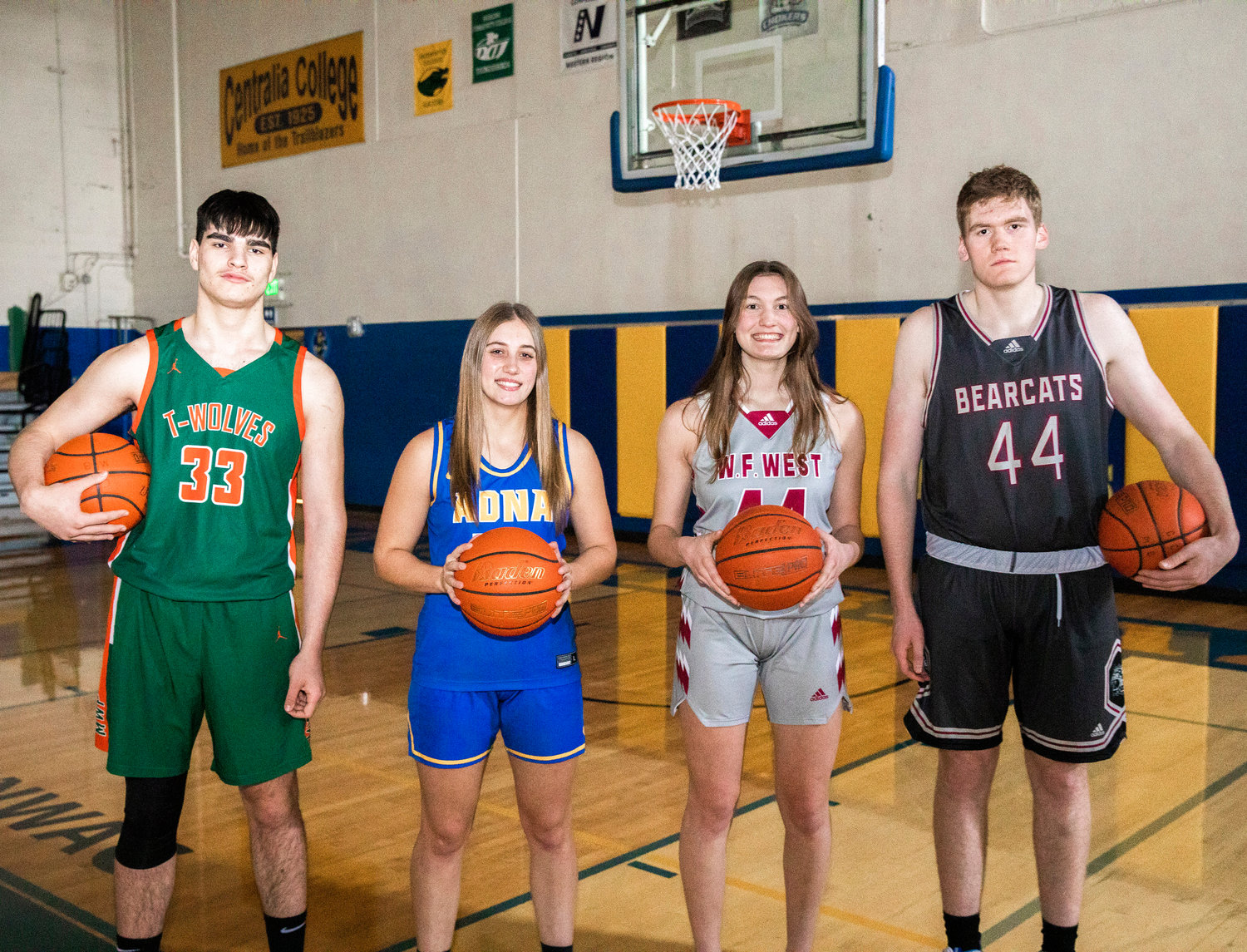 From left, MWP’s Josh Salguero, Adna’s Karlee VonMoos, and W.F. West’s Juila and Soren Dalan hold basketballs and pose for a photo in the Centralia College gymnasium on Tuesday.