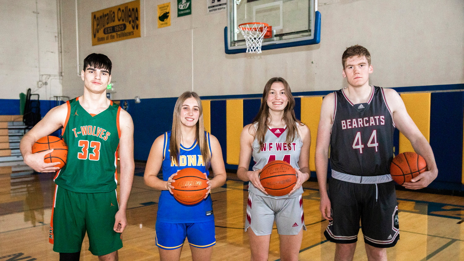 From left, MWP’s Josh Salguero, Adna’s Karlee VonMoos, and W.F. West’s Juila and Soren Dalan hold basketballs and pose for a photo in the Centralia College gymnasium on Tuesday.