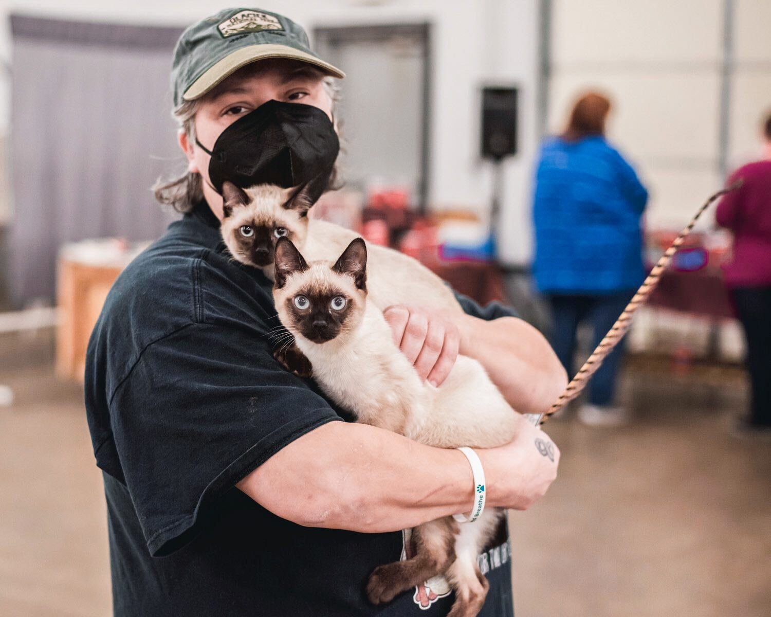 FILE PHOTO — Jeanette McLeese carries two kittens named Bob and Deziray through the Southwest Washington Fairgrounds in Centralia.