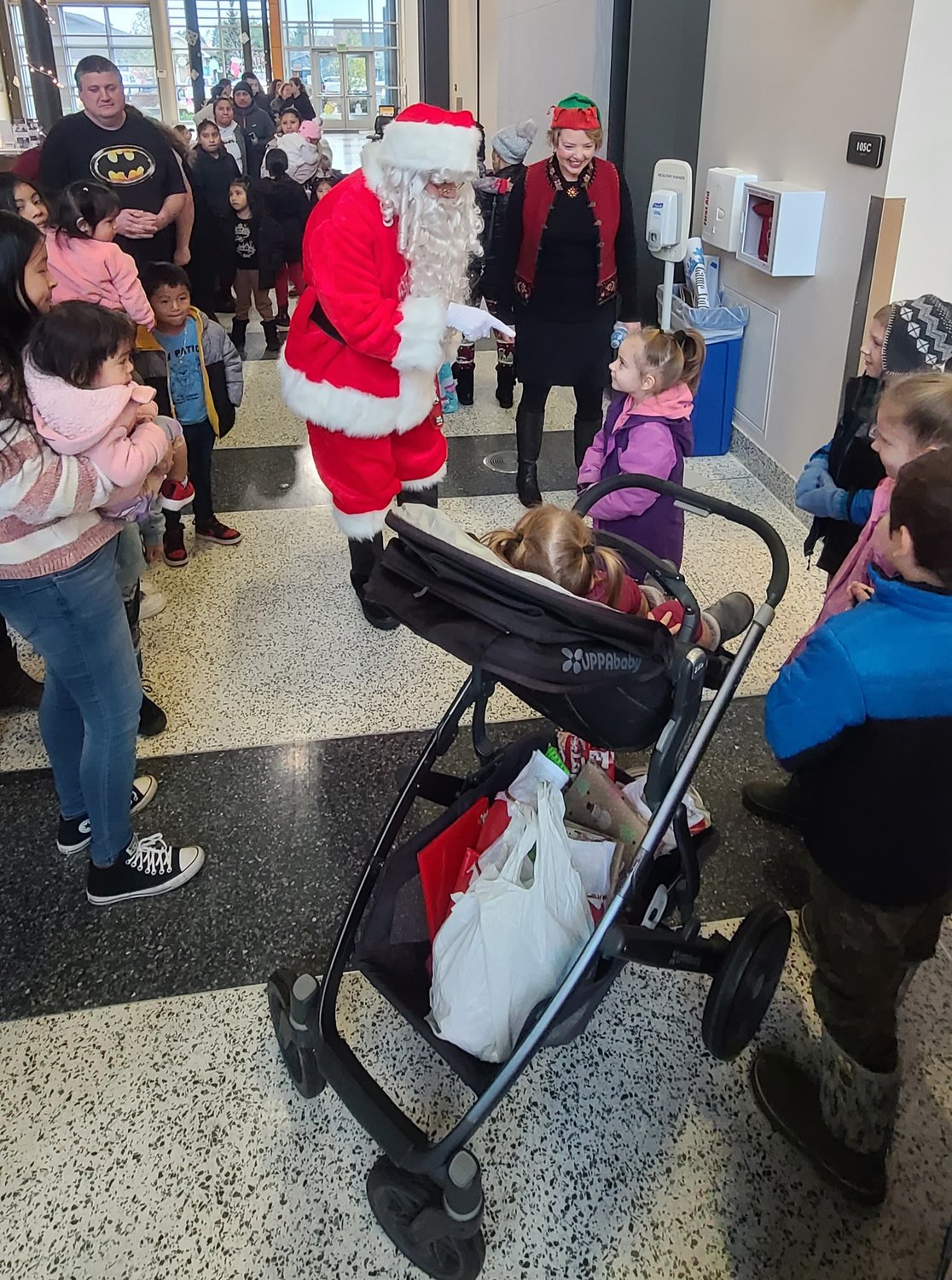 On Saturday at Centralia College, United Way of Lewis County hosted 270 kids for a gift giveaway, with each receiving a new toy and book from Santa Claus.  