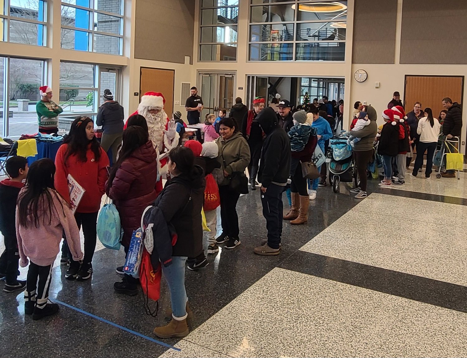 On Saturday at Centralia College, United Way of Lewis County hosted 270 kids for a gift giveaway, with each receiving a new toy and book from Santa Claus.  