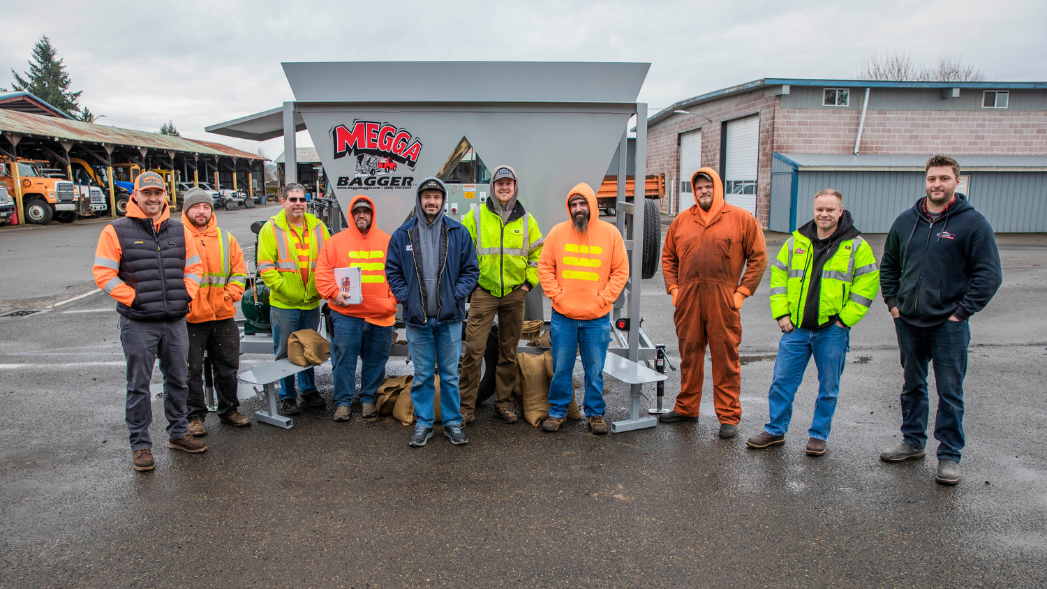 Centralia Public Works smile for a photo in front of the city’s new sandbag machine that was delivered Monday morning to the Public Works shop on Reynolds Avenue.