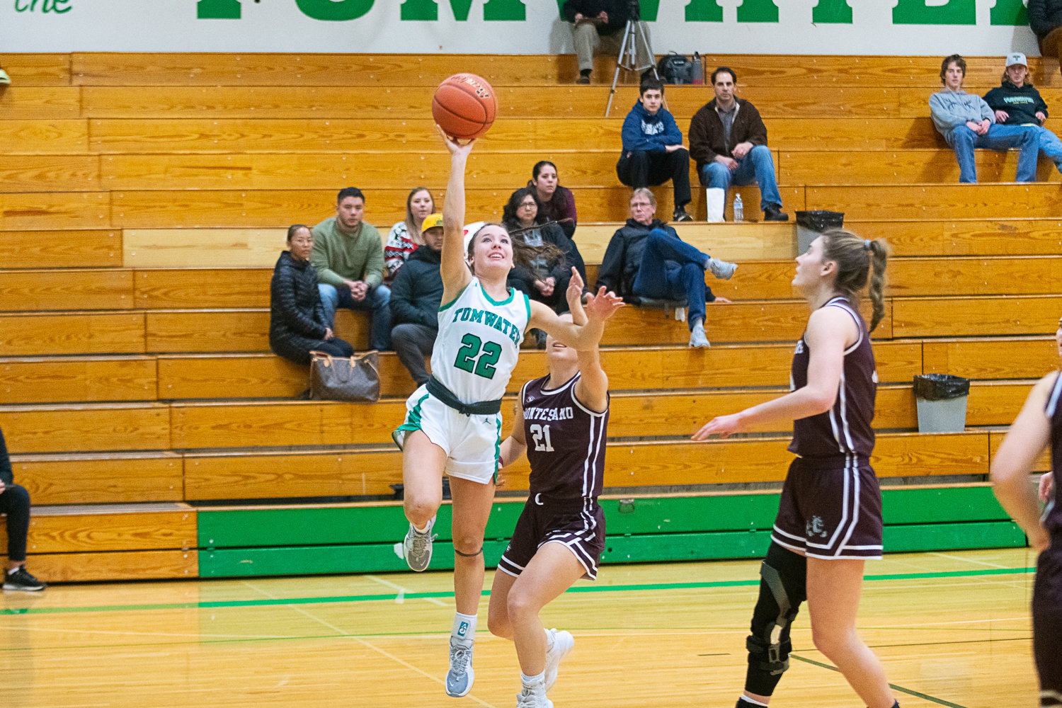 Tumwater junior Regan Brewer lifts a layup to the rim during the first quarter of the T-Birds' 37-21 loss to Montesano on Dec. 22.