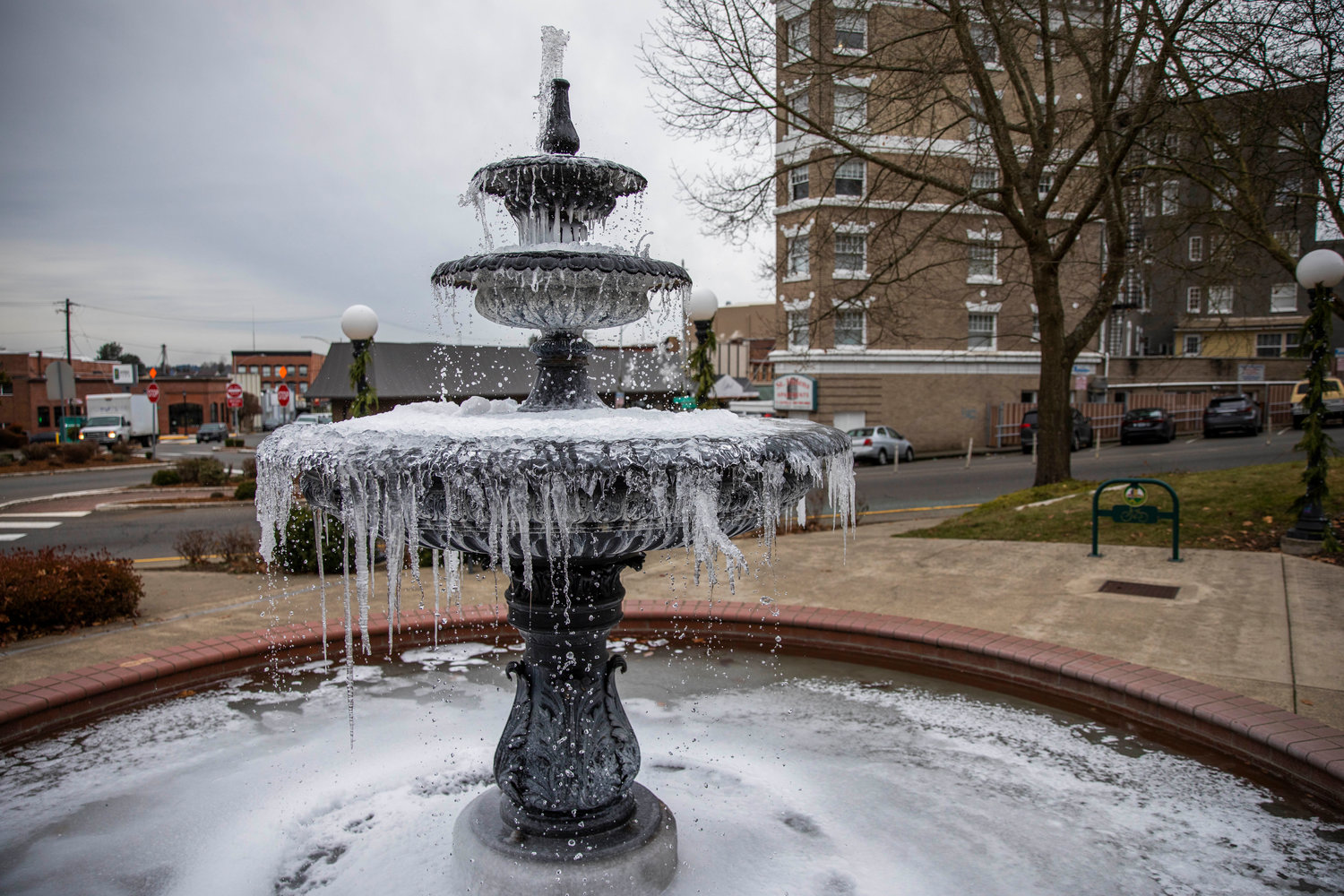 FILE PHOTO — Water continues to fall as icicles form on the fountain outside the Vernetta Smith Chehalis Timberland Library in December 2022.