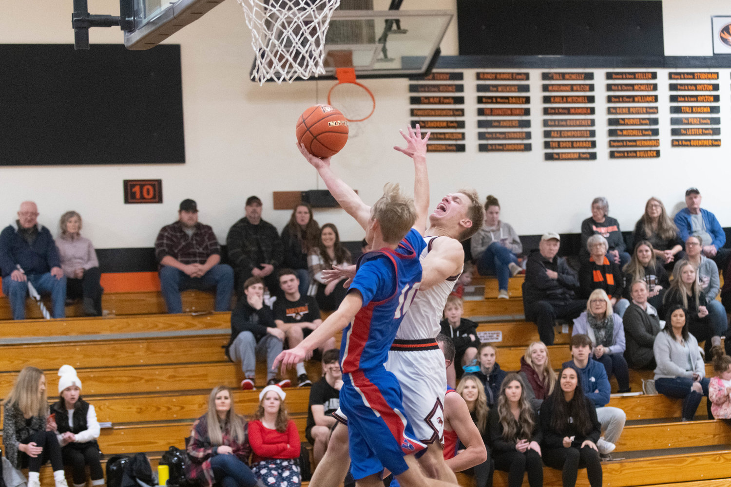 Cael Stanley fights through contact for a transition layup during the first half of Napavine's 81-50 win over Willapa Valley on Dec. 27.