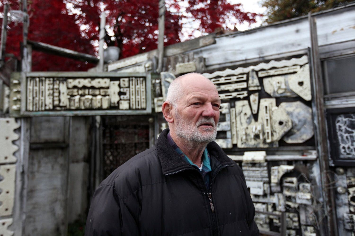 Artist Richard Tracy, also known as RichArt, stands in the yard at his home along Harrison Avenue in Centralia in  2011.