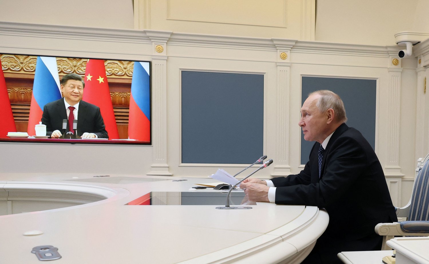 Russian President Vladimir Putin holds a meeting with Chinese President Xi Jinping via a video link at the Kremlin in Moscow on December 30, 2022. - Russian leader told his Chinese counterpart on December 30 he was keen to ramp up military cooperation and hailed the two countries' efforts to counter Western influence. (MIKHAIL KLIMENTYEV/SPUTNIK/AFP via Getty Images/TNS)