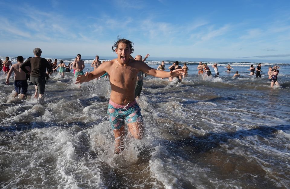 Hundreds of people started 2023 by jumping into the Pacific Ocean during the 19th annual Polar Plunge at Neahkahnie Beach in Manzanita.