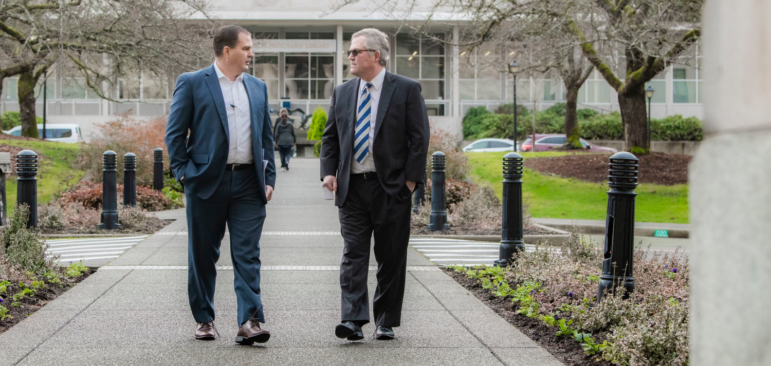 State Sen. John Braun, R-Centralia, walks alongside state Rep. J.T. Wilcox, R-Yelm, outside the Washington state Capitol Building in Olympia on Thursday. Braun is the Senate Republican leader and Wilcox is the House Republican leader.