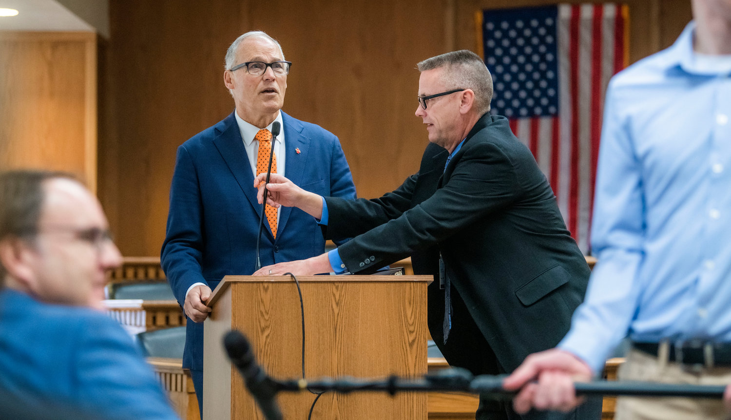 A mic is adjusted for Governor Jay Inslee before he takes question from members of the press on Thursday inside the John A. Cherberg Building in Olympia.