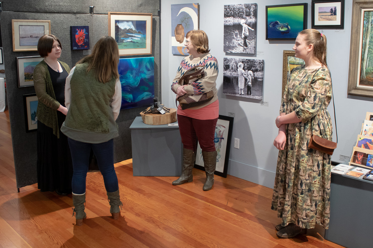 Enaliya Rubin, right, and Acacia Senn, left, answer questioned from gallery viewers about their work currently on display at the Rectangle Gallery & Creative Space.
