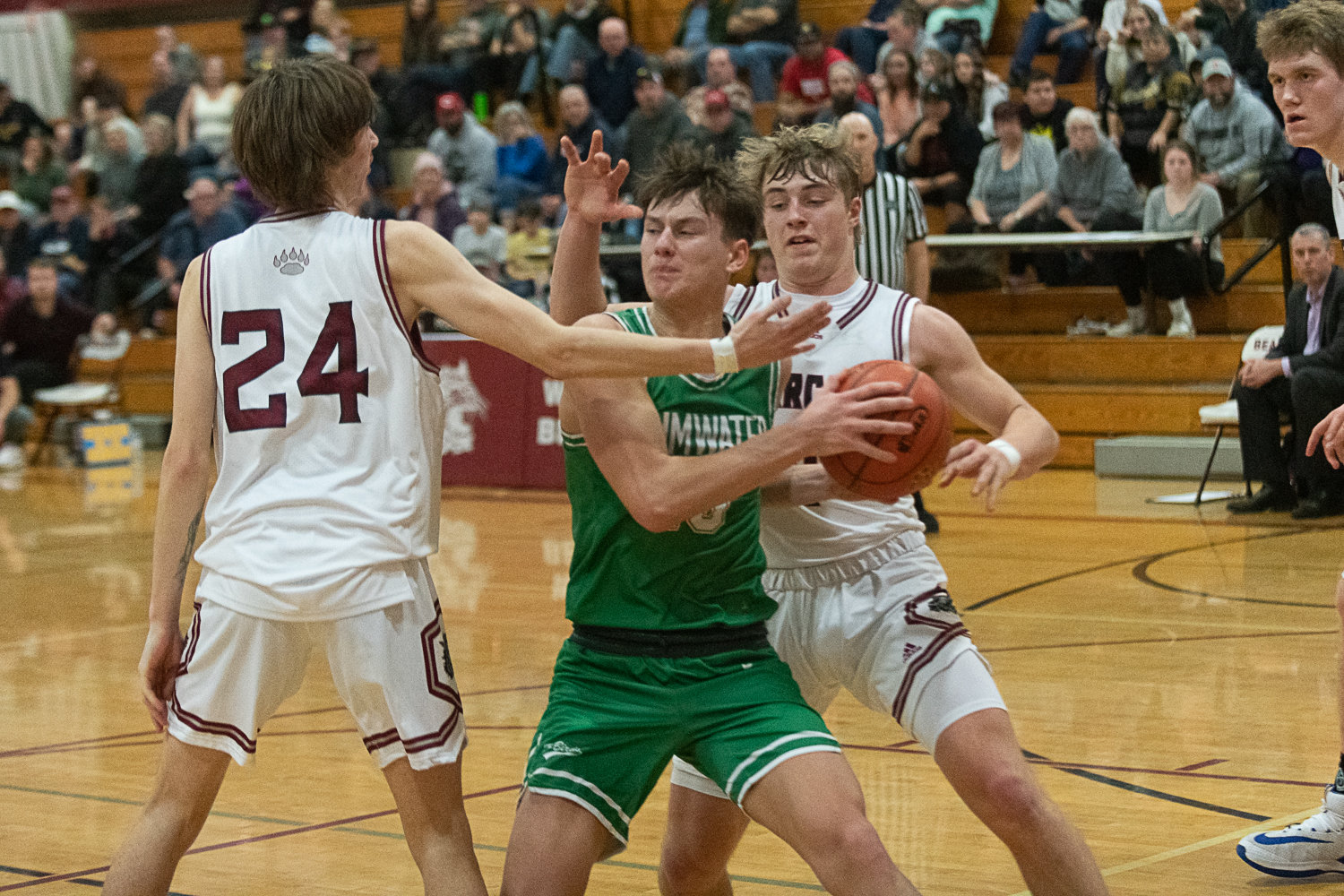 Andrew Collins tries to pass the ball out during the second half of Tumwater's 71-58 win at W.F. West on Jan. 11.