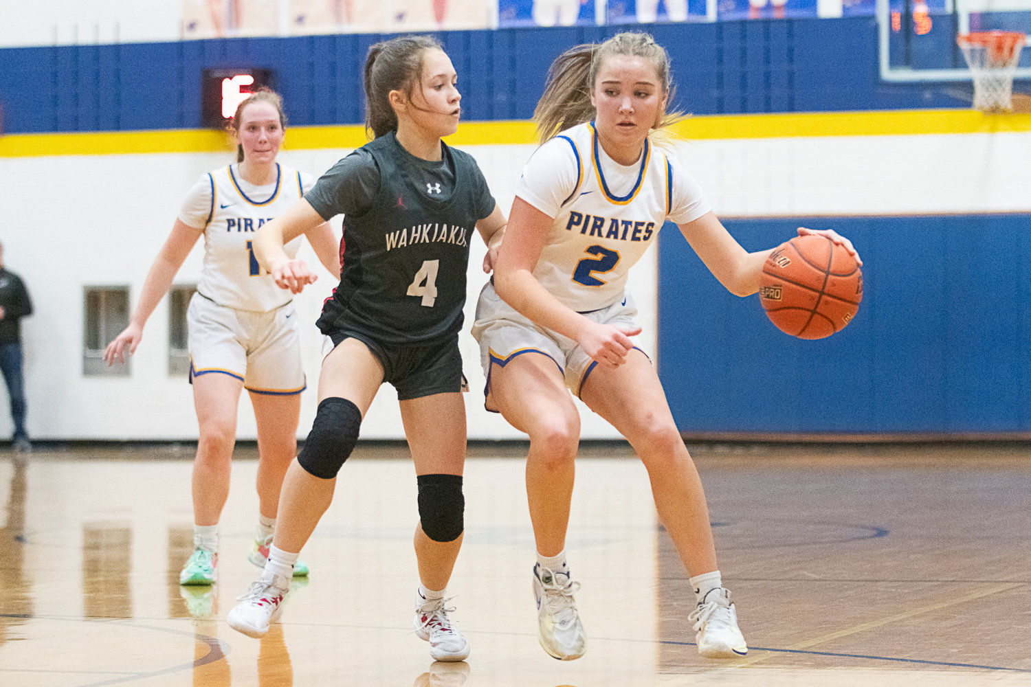 Danika Hallom shields the ball from a defender during Adna's 72-28 win over Wahkiakum on Jan. 13.