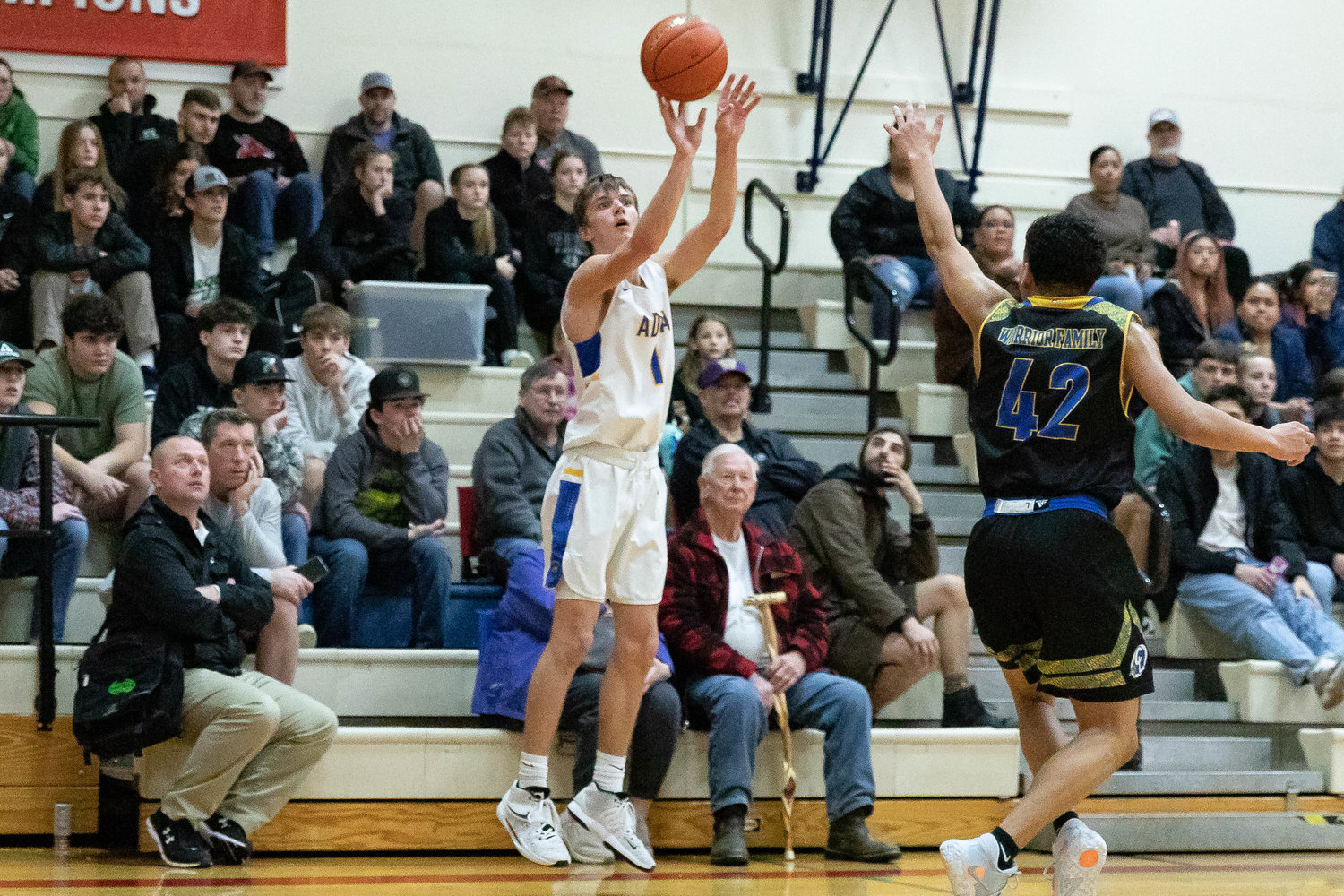 Adna guard Seth Meister takes a 3-pointer against Chief Leschi Jan. 16 at the MLK Classic at Lower Columbia College in Longview.