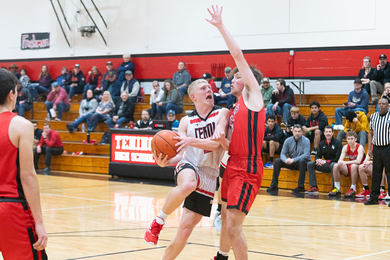 Austin Gonia draws contact going to the hoop during the first half of Tenino's 65-46 win over Mossyrock on Jan. 18.