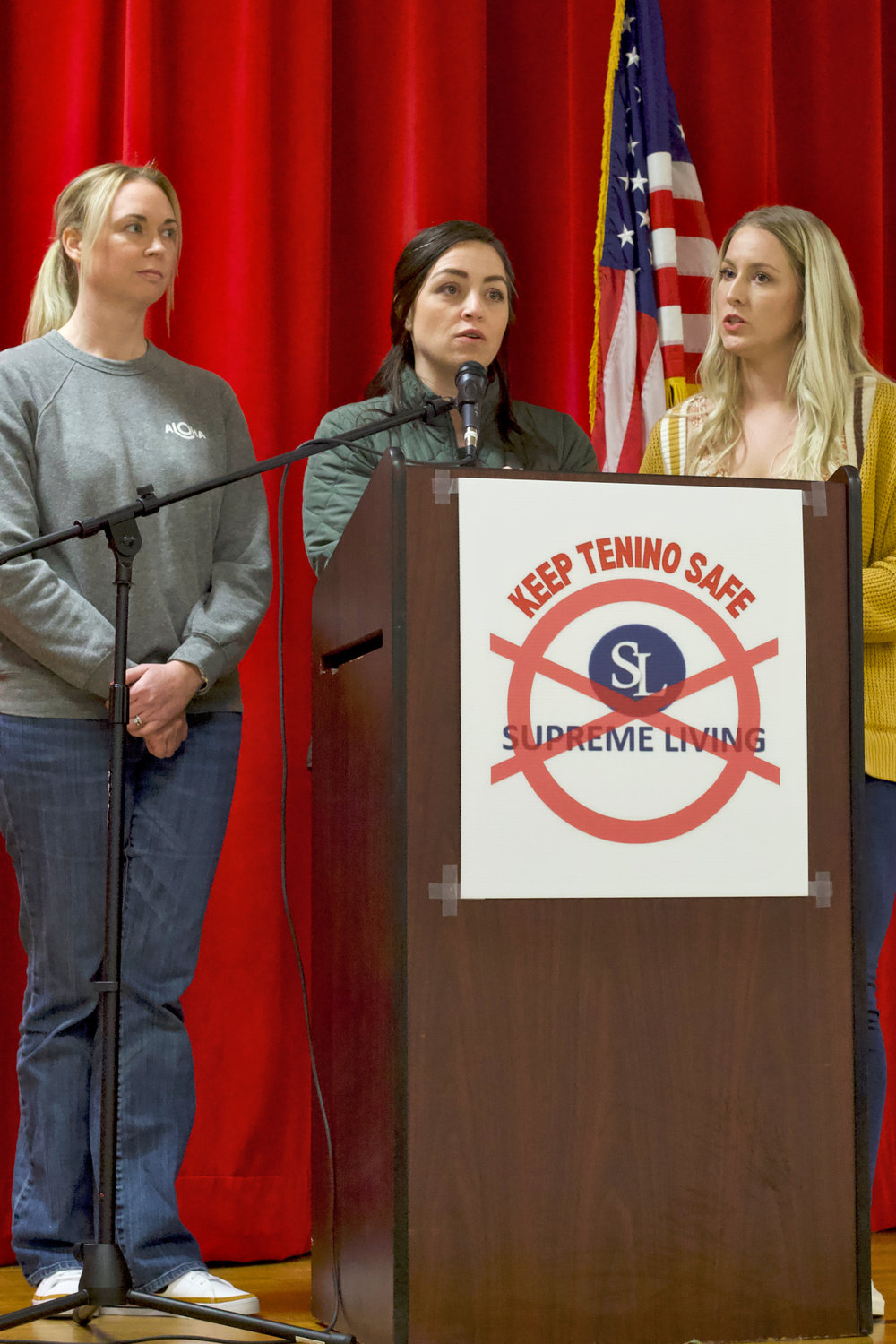 From left, Tenino-area residents Sarah Fox, Kerri Jeter and Kendall Tutlle speak during a community meeting at Tenino High School on Sunday where residents gathered to discuss plans to oppose a Supreme Living-run Less Restrictive Alternative facility for sex offenders.