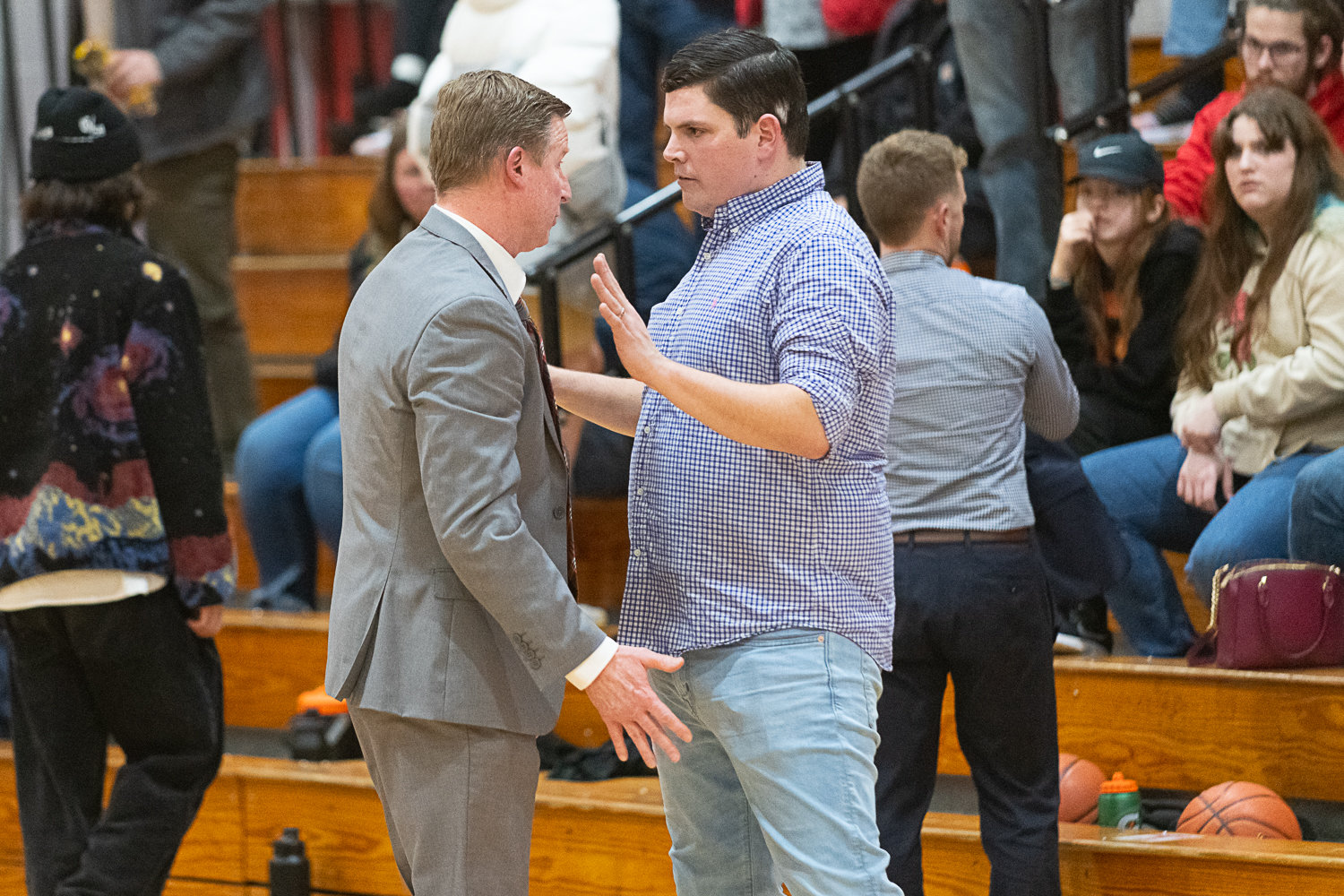Tenino coach Ryan Robertson and Hoquiam coach Jeff Niemi talk things out after an animated end to the Grizzlies' 47-33 win over the Beavers at Brock Court on Jan. 24.