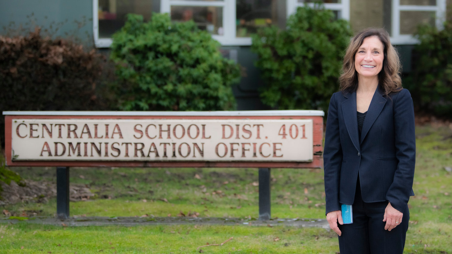 Centralia Superintendent Lisa Grant smiles for a photo in front of the district administration office Tuesday afternoon.