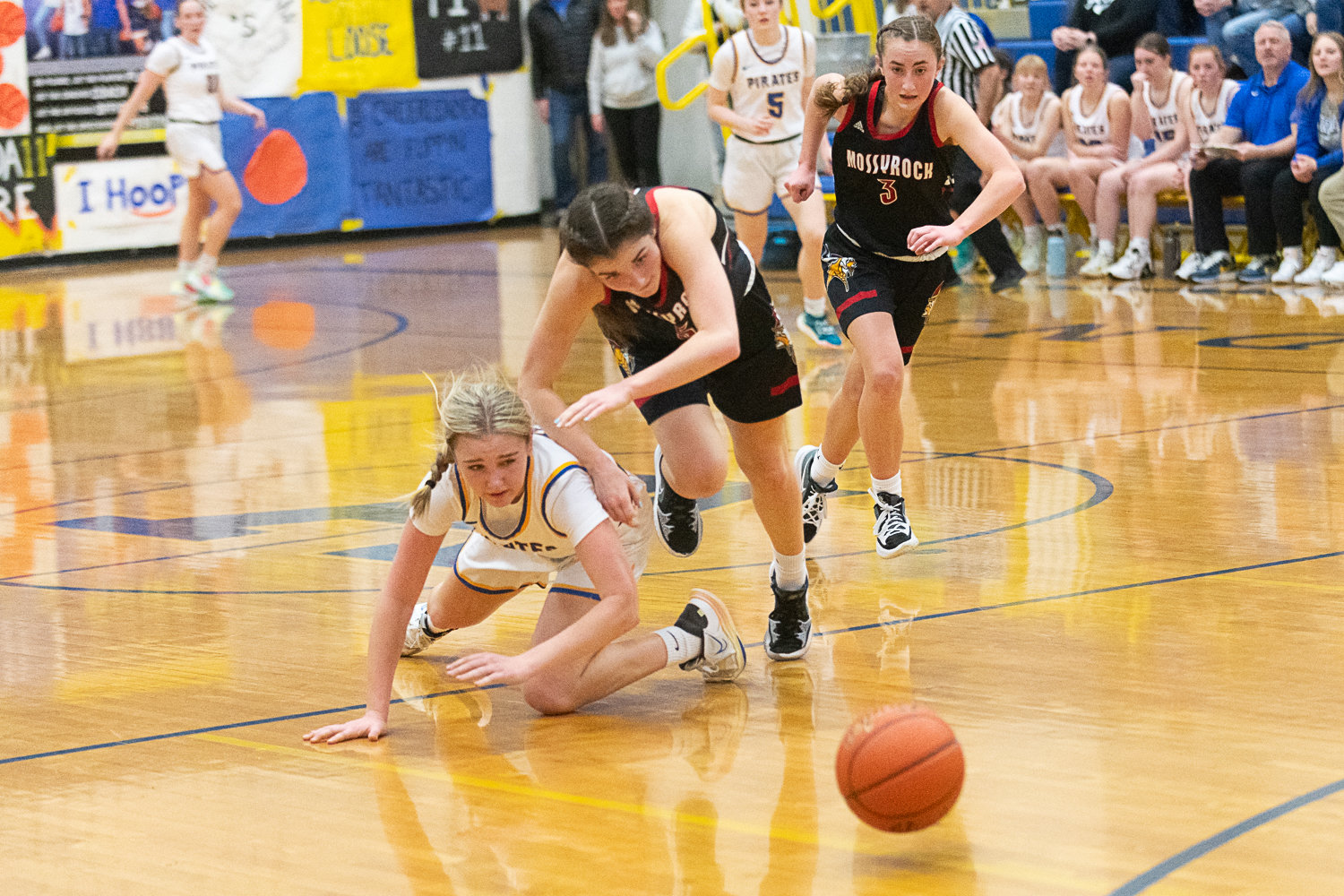 Adna's Danika Hallom and Mossyrock's Payton Torrey go after a loose ball in the back court during the fourth quarter of the Pirates' 58-48 win on Jan. 27,