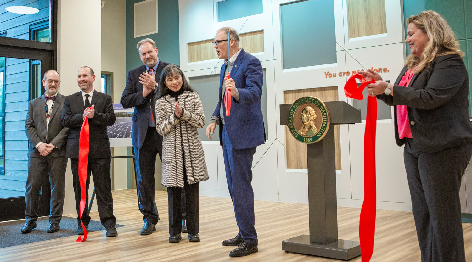 Gov. Jay Inslee and other officials cut the ribbon on a new Civil Center for Behavioral Health at Maple Lane School between Centralia and Rochester during a grand opening ceremony on Friday, Jan. 27.