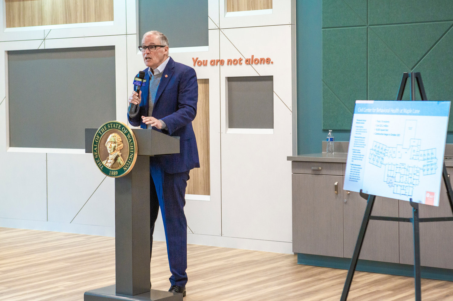 Gov. Jay Inslee addresses a group during a grand opening of a new facility at Maple Lane School on Friday Jan. 27.