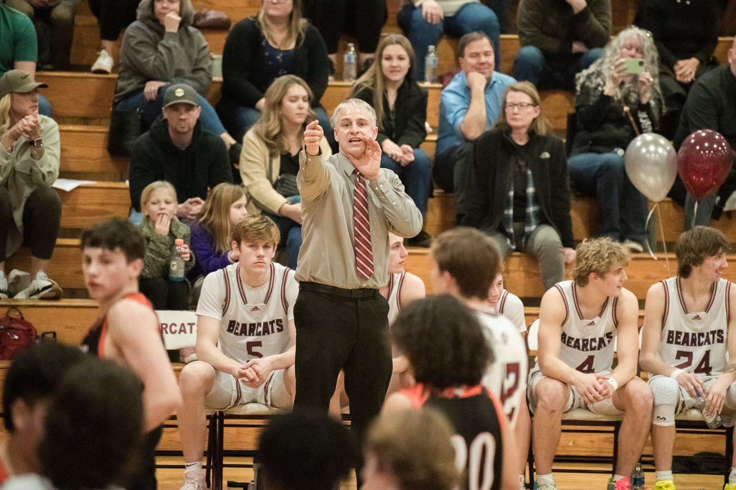 W.F. West Head Coach Chris White points athletes into position during a Tuesday night game in Chehalis.