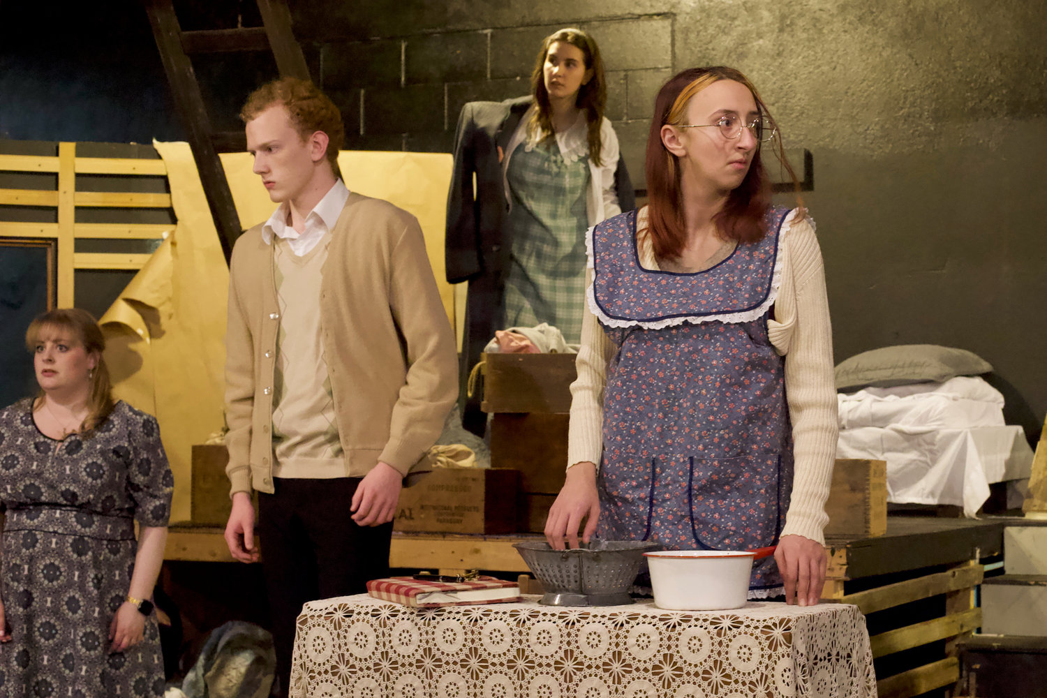 Residents of the Secret Annex react to a siren during a rehearsal of “The Diary of Anne Frank” at the Evergreen Playhouse in Centralia last week. From left is Emilie Brown as Mrs. Van Dann, Nathan Crummett as Peter Van Daan, Ruby Stanton as Anne Frank and Lizzie Conner as Margot Frank.