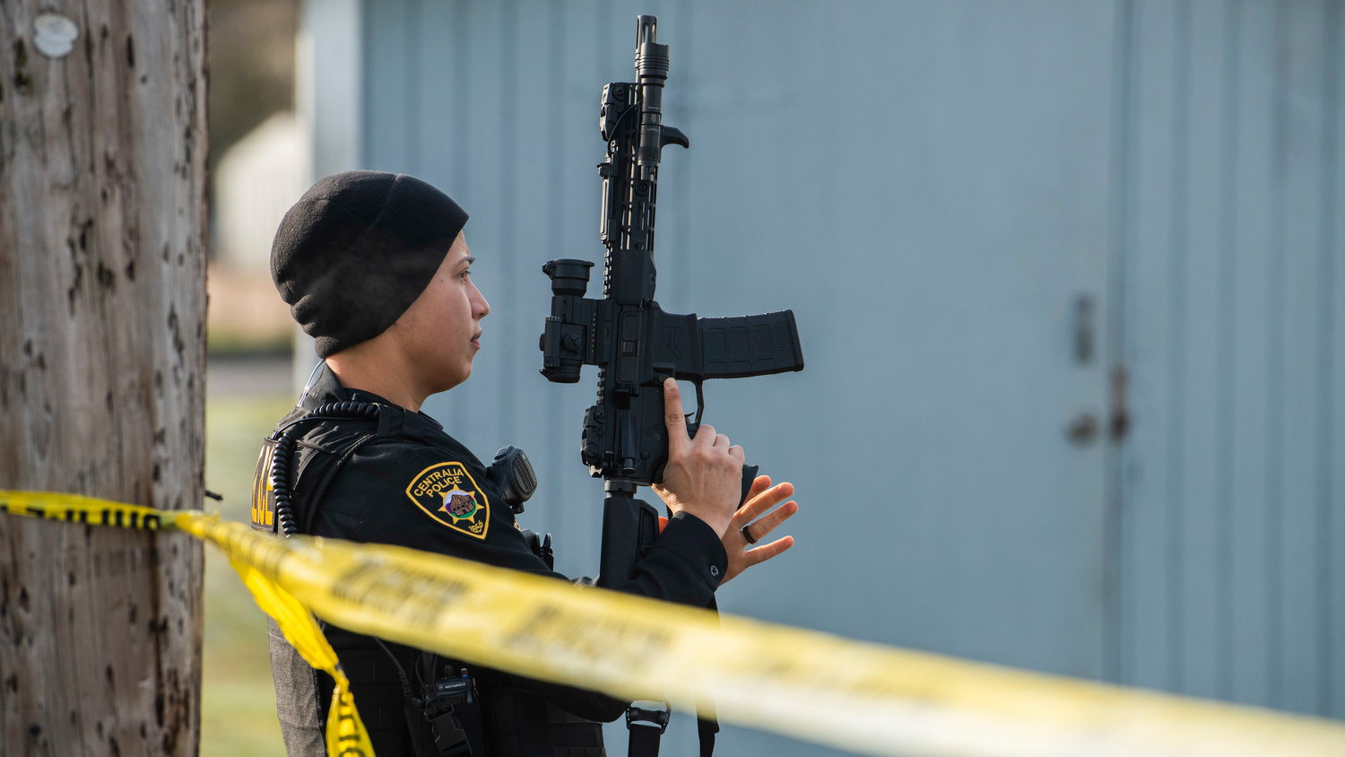 A Centralia police officer arrives on scene indexing a rifle in  the 1300 block of Windsor Avenue in Centralia on Thursday.
