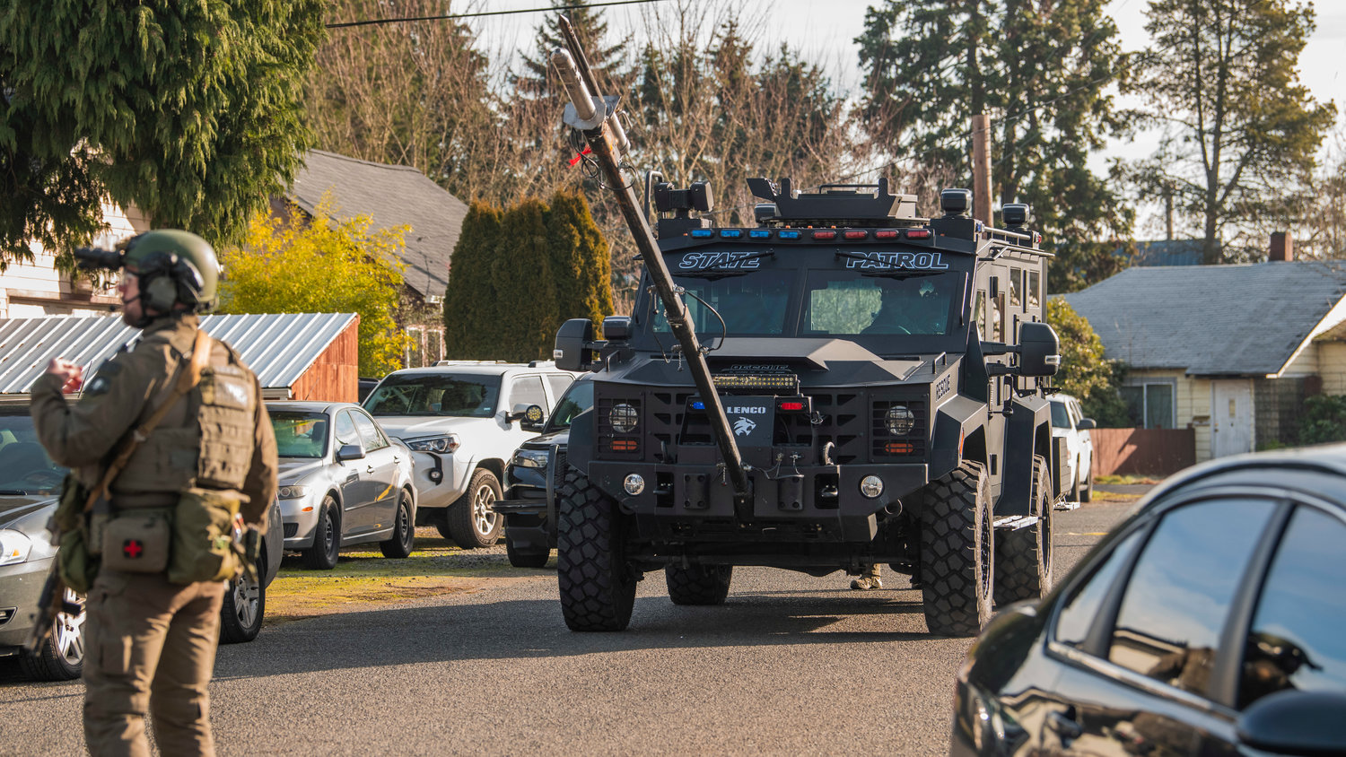A gas delivery system is seen attached to a Washington State Patrol vehicle in the 1300 block of Windsor Avenue in Centralia on Thursday as additional units arrive on scene.