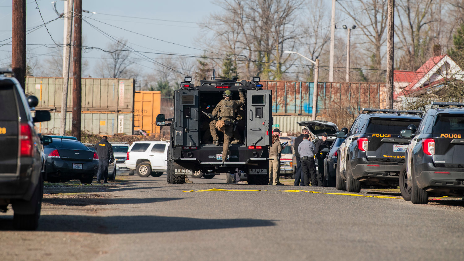 S.W.A.T teams respond to an active scene in the 1300 block of Windsor Avenue in Centralia on Thursday.
