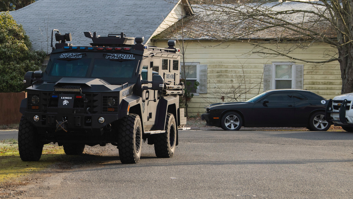 Additional units arrive at an active scene in the 1300 block of Windsor Avenue in Centralia on Thursday.