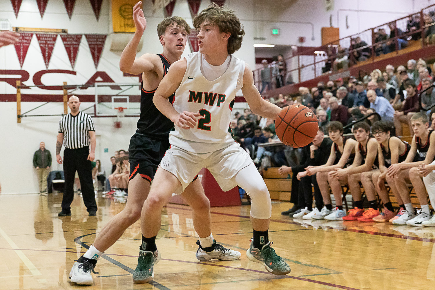 Morton-White Pass guard Judah Kelly scans the Rainier defense in the 2B District 4 quarterfinals at W.F. West Feb. 8.