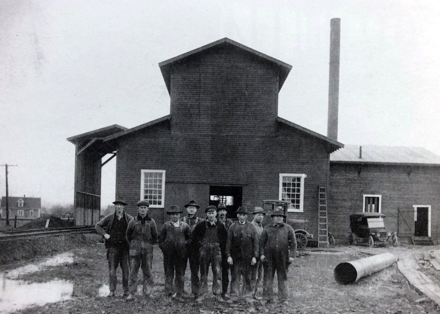 HISTORY PHOTO OF THE WEEK: This 1920 photo is of a Centralia plant that manufactured briquettes from coal dust using a petroleum-based binder. It was located in the vicinity of what is now the 1100 block of J and K streets in Centralia. The plant was in operation during the early 1920s and was run by a man known as "King" Kenny and his brother. The third man from the left in this photo is Sutton Nunn. Nunn was born in England in the town of Sutton and worked at the time at the plant. He came to Centralia by way of Canada and married Elsie Wright Nunn. The couple had three children they raised in Centralia. Nunn descendants remain in the area. This photo and information was originally submitted by Jim Nunn, grandson of Sutton Nunn, for The Chronicle’s Our Hometowns books.