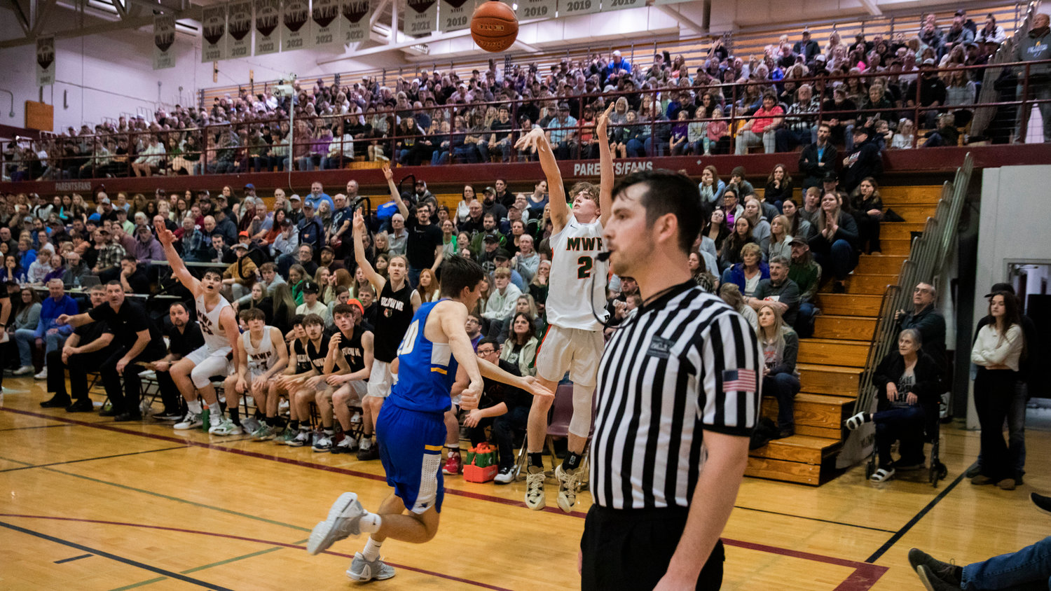 Morton-White Pass sophomore Judah Kelly (2) shoots a 3-pointer in a 2B District Championship game against Adna Saturday night at W.F. West High School.