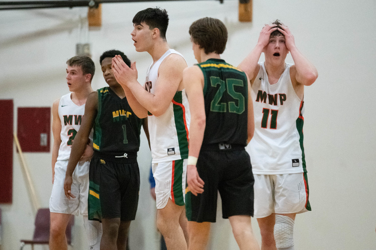 Josh Salguero and Hunter Hazen have a tough time believing a call during the second half of MWP's win over Northwest Christian in the 2B state tournament's opening round, at Chehalis on Feb. 25.