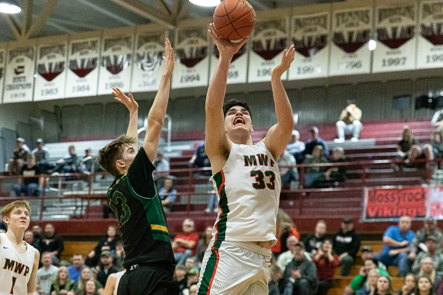 Morton-White Pass center Josh Salguero throws up a shot in an opening round of state matchup against Northwest Christian (Colbert) at W.F. West Feb. 25.