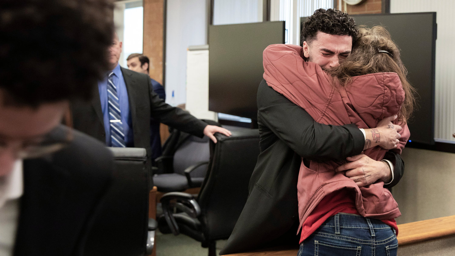 Joshua Darrow, known professionally as “Band Kid Jay,” receives an embrace while reacting to a not-guilty verdict reached by a jury in Lewis County Superior Court on Thursday in Chehalis.