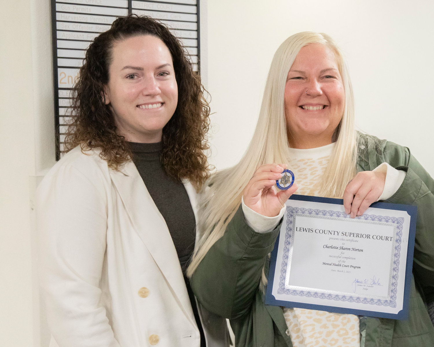 Coordinator Sophia Limacher smiles for a photo with Charlotte Sharon Norton on Thursday after a successful completion of the Mental Health Court Program.